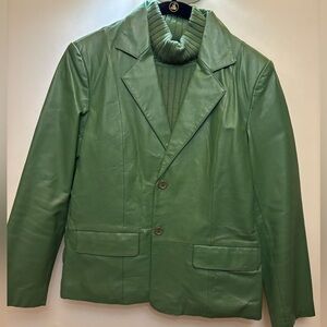 Leather jacket and matching sleeveless turtleneck sweater.